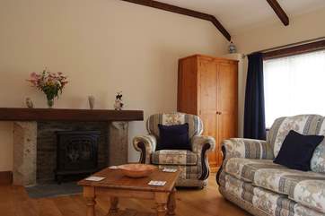 A wood-burner effect electric stove adds warmth and a focal point to the living-room.