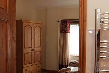 Looking from the bathroom into the bedroom.