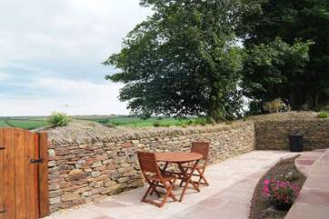 The enclosed courtyard at the rear of the cottage has a gate out to the Owners' land where guests can follow a walk.