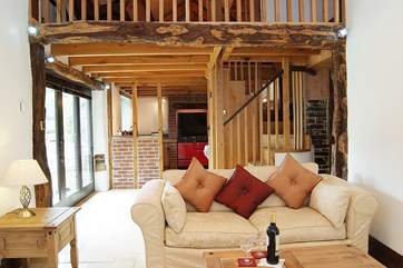 Dreamcatcher's stunning interior includes a mezzanine-area, a wood-burning stove and French windows to the garden and patio.