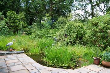 The patio-area and garden with pond. Please take care with children.