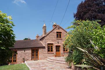 Court Cottage has a large enclosed garden, secure off road parking and a sunny stone terrace with direct access to both the living room and the kitchen.