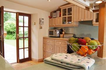 French windows from the kitchen lead directly to the patio and garden.