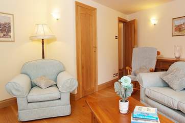 The door to the master bedroom is in the far corner of the sitting-room.
