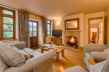 The cottage has a wonderful traditional feel with a large stone fireplace, an open fire and solid oak floors throughout.