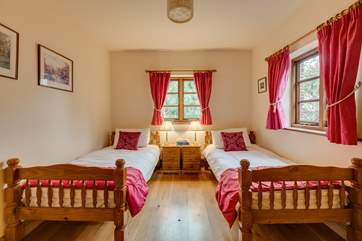 This is the twin bedroom on the ground floor looking out over the garden.