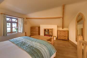 The bedroom looks out over the garden at the front of the cottage.