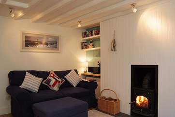 The sitting-room has a roaring wood-burner.