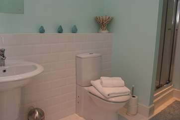 The family bathroom has a bath and shower cubicle.