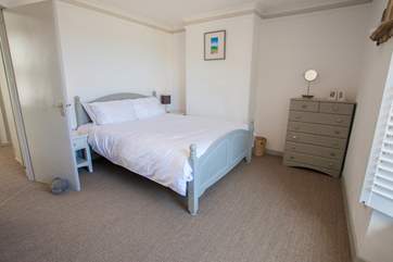 The master bedroom has a king-size bed.