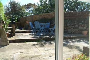 The view of the enclosed courtyard through the back kitchen window.