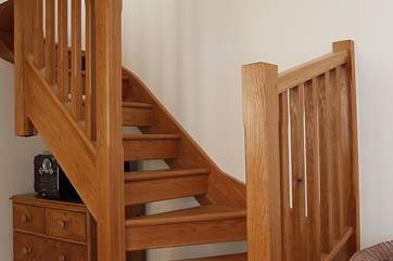 A hand-built, open tread staircase leads to the first floor.