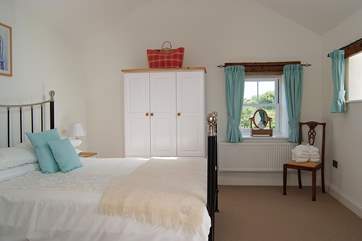 The first floor's spacious double bedroom (Bedroom 2) has a king-size bed.