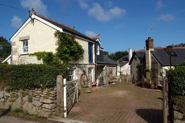 The entrance to Pilgrim's Barn and the Owner's home. The private parking space for the cottage is a few yards beyond the driveway (just out of the picture to the left).