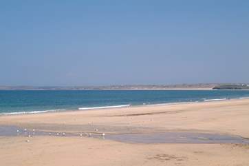On its journey between Hayle and St Ives the little seaside train stops at spectacular Carbis Bay.