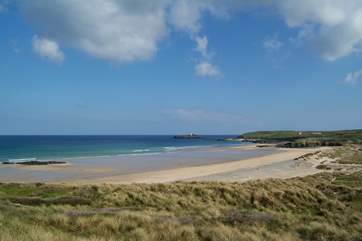 Miles of golden sands stretch between Hayle beach and Godrevy lighthouse, which marks the far end of St Ives Bay.
