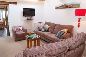 The light and spacious sitting-room leads through to the large kitchen/dining-room.