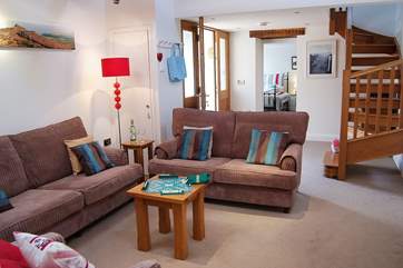 The ground floor bedroom lies at the other end of the sitting-room from the kitchen/dining-room.
