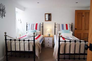 The pretty ground floor twin bedroom (Bedroom 1).