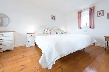 The master bedroom boasts a 6' bed.