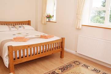 Bedroom 1, the master bedroom, is a lovely spacious room.
