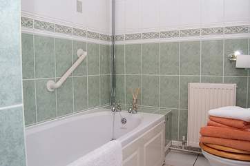The bathroom lies off the ground floor hall and has a bath and separate shower.