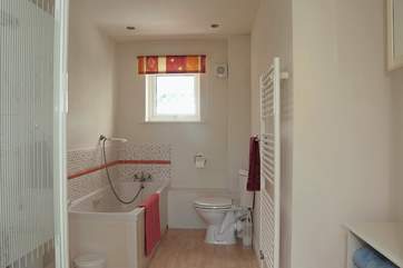 The bathroom is on the ground floor next to the twin bedroom. The bathroom has a separate shower cubicle as well as a bath.