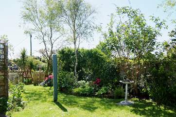 A little gate at the end of the small enclosed garden leads out onto a footpath running behind the house - ideal for an early morning dog walk!