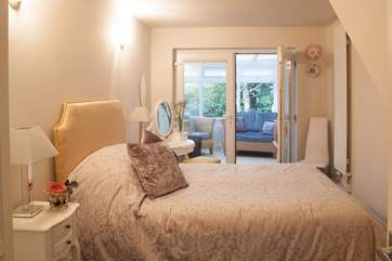 Glass doors from the double bedroom lead through to the conservatory.