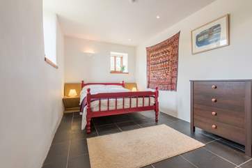 This ground floor bedroom has a wash-basin.