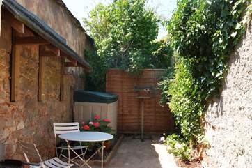 There is a second patio to the rear of the cottage.