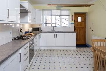 Spacious kitchen, which leads out to the terraced garden at the rear.