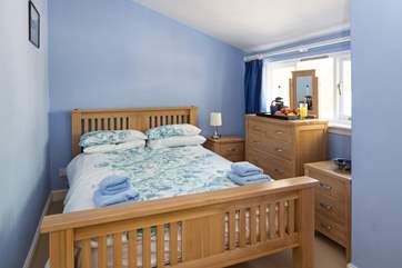 The double bedroom looks over the rear garden.