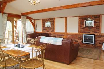 The spacious living area has two deep comfortable leather sofas to relax in