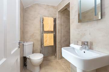 The en suite has a great wet-room style shower tucked around the corner.