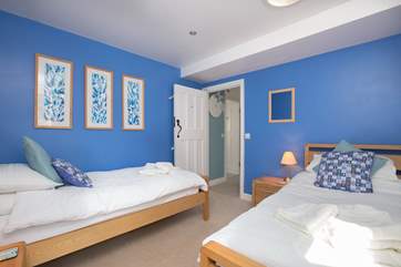 There is a bright and cheerful twin bedroom.