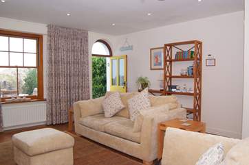 A lovely bright and spacious living room faces towards the front of the house with its enclosed garden and of course the dunes, beach and sea just steps away.