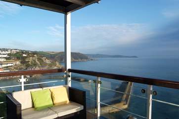 The covered balcony provides a grandstand view of Mevagissey harbour and bay.
