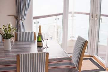 The dining-area opens onto the balcony.