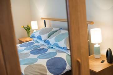 Mirrored wardrobes reflect plenty of light in Bedroom 2.