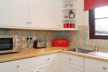 Although small, the kitchen is fully equipped.