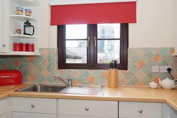 The kitchen looks out over a little courtyard.