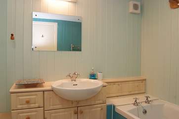 The bathroom is on the lower ground floor next to the bedrooms.