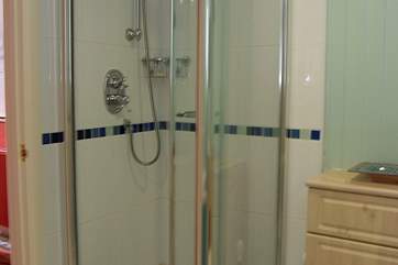The bathroom also has a separate shower cubicle.