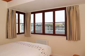 Bedroom 1 has views across the water.