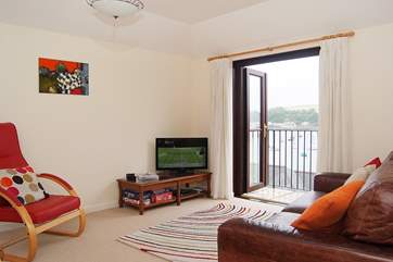 The sitting-area has French doors onto the balcony making the most of those fabulous views whatever the time of year.