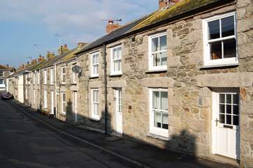 Driftwood Cottage is the second property from the right in the photograph, with the satellite dish outside.
