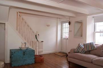 The front door opens directly into the light, surprisingly spacious sitting-room.
