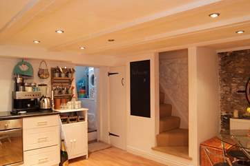 The steep stairs down to the lower ground floor have very low headroom - so 'duck or grouse', as they say!