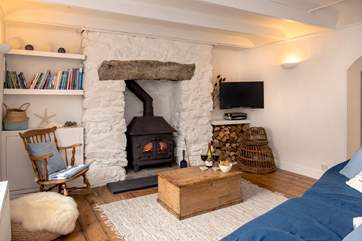 The cosy sitting-room awaits your arrival.